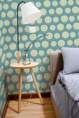 Self-adhesive retro floral sunnies wallpaper with a repeating pattern of large, stylized yellow flowers with dark centers on a teal background, adding a vintage vibe to the room.