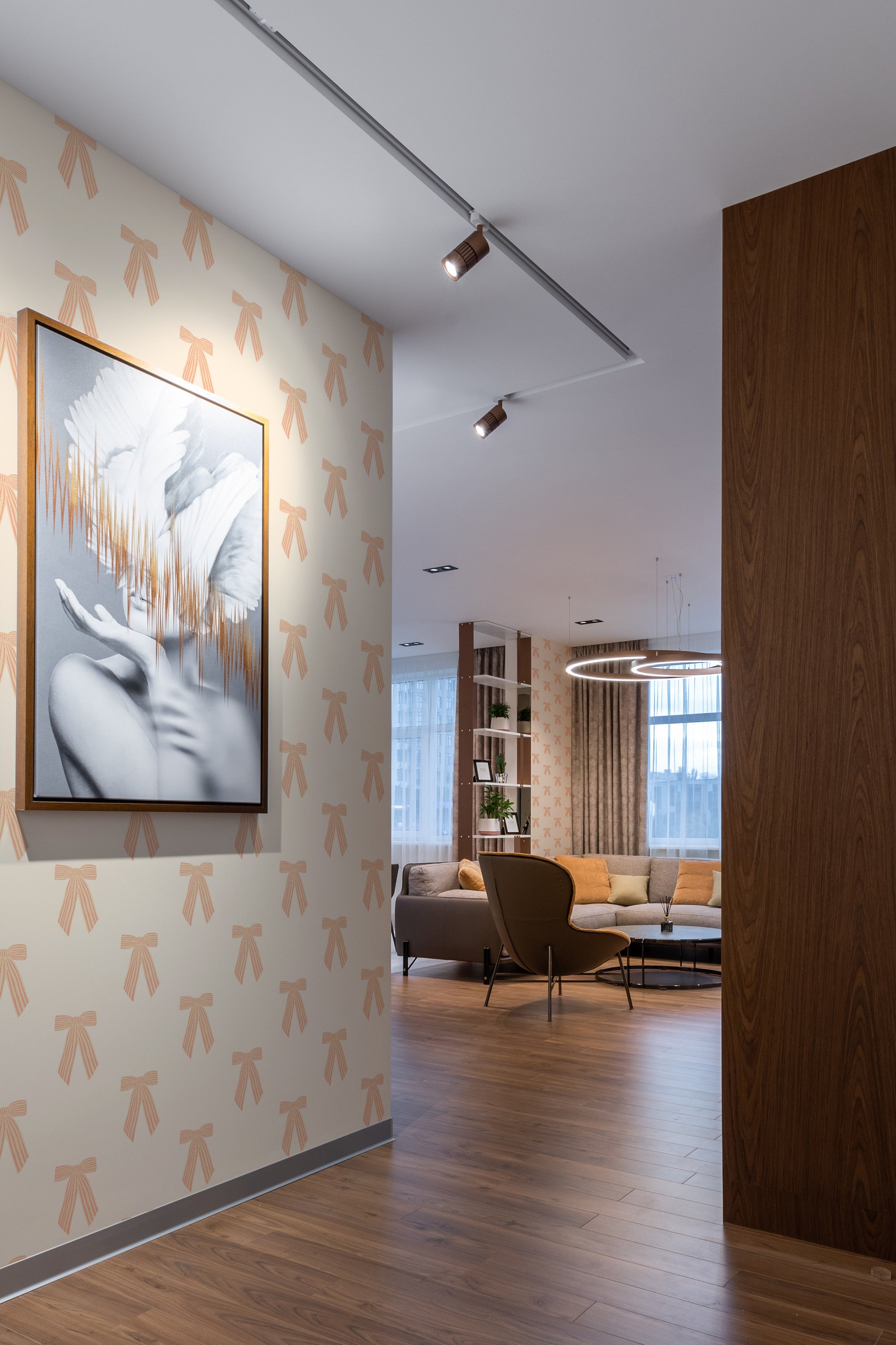 Horizontal stripes with a vintage bow pattern in a soft color palette on a room's wall, conveying a classic and elegant ambiance, traditional wallpaper.