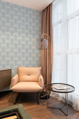 A room with a wall covered in vintage ribbon patterned wallpaper in soft hues, alongside elegant drapery and modern furnishings, invoking a sense of traditional wallpaper.