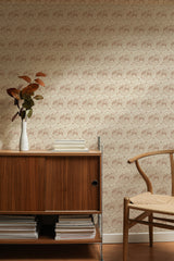 Self-adhesive Vintage Rabbit wallpaper with a repeated pattern of rabbits within ornate frames on a beige background, behind wooden furniture.
