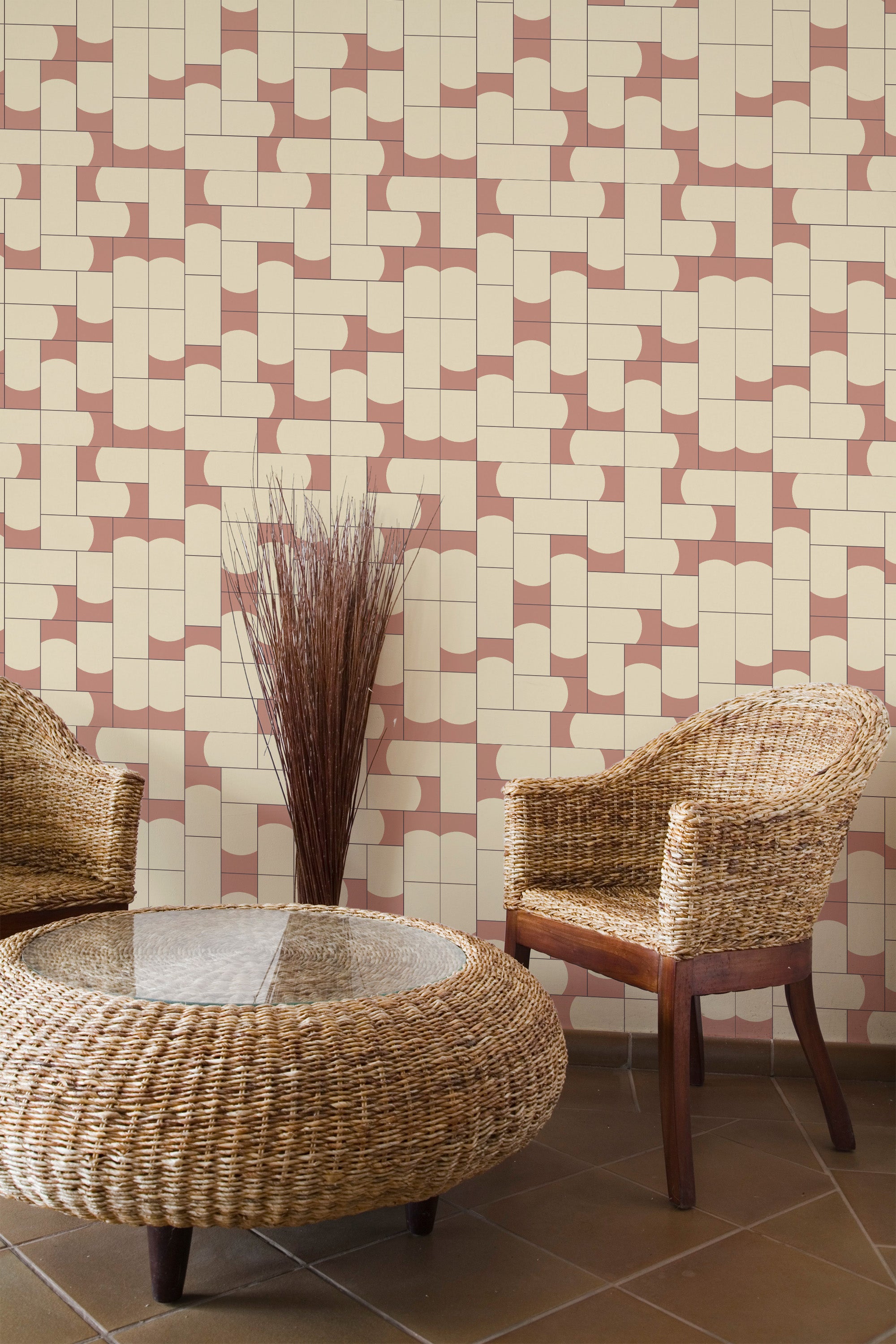 Self-adhesive terracotta tile pattern wallpaper in a geometric design with pale pink and off-white colors, complementing the wicker furniture and earthy room decor.
