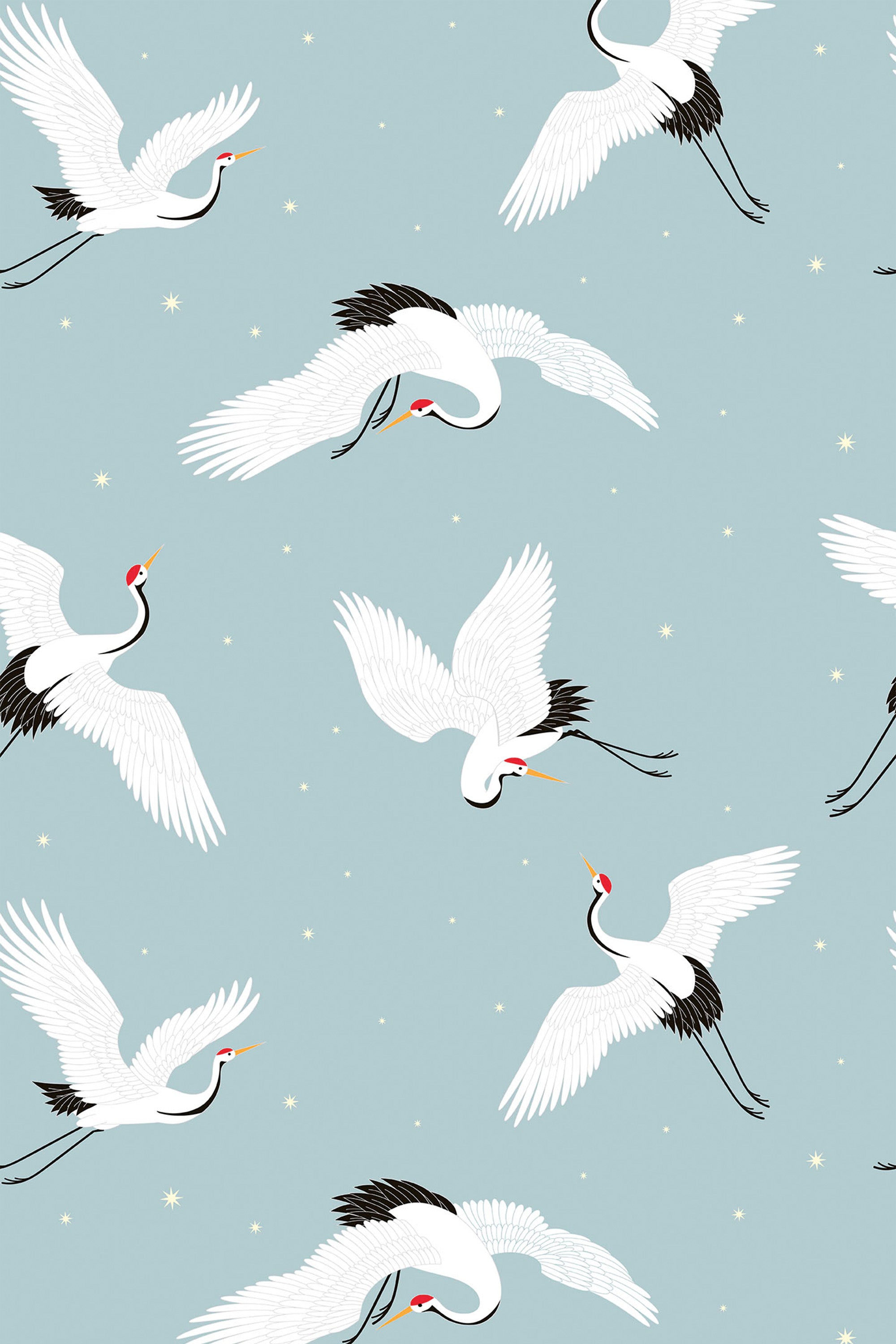 Pattern of white cranes on a light blue background