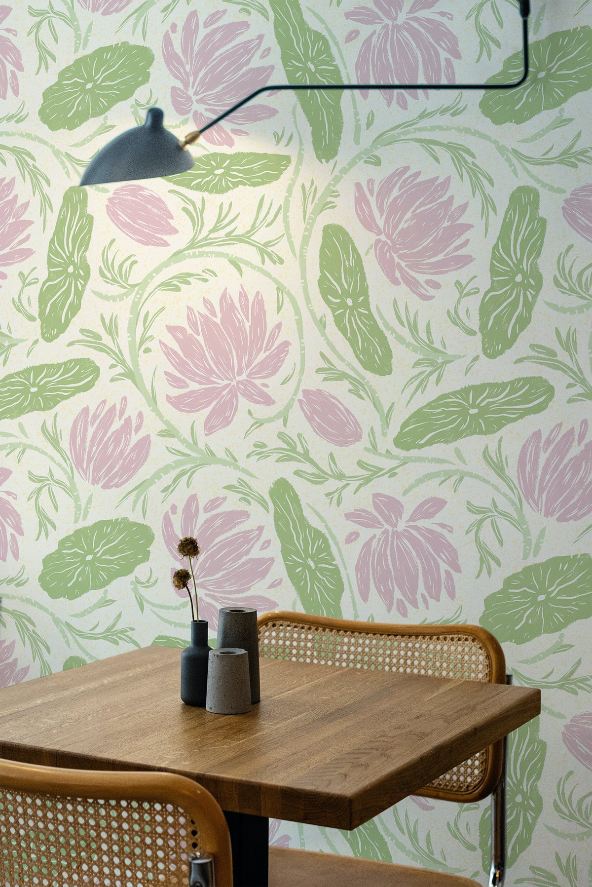 Bold Floral Vines pre-pasted wallpaper on an interior wall with pink florals and green leaves on cream.