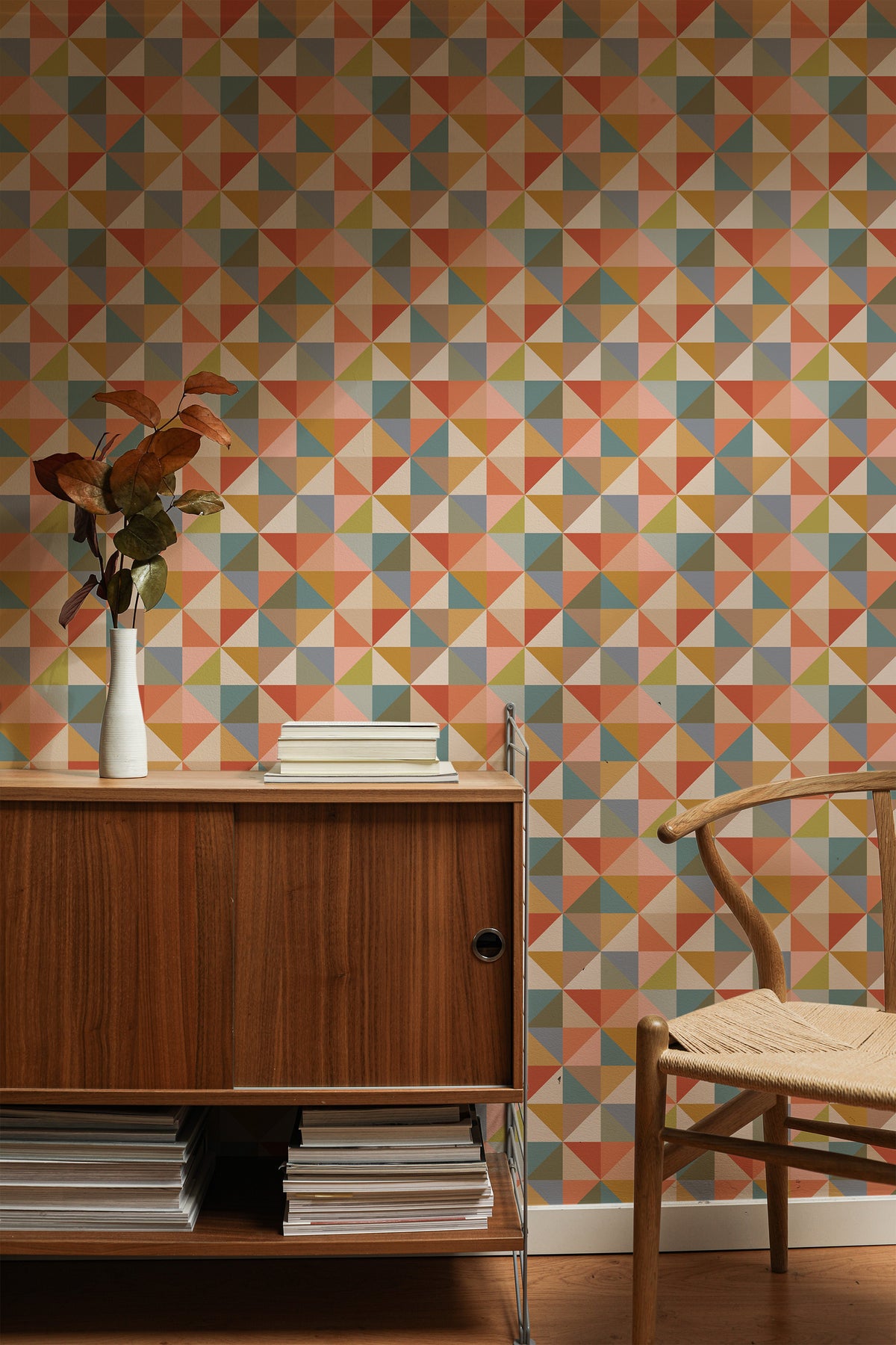 Boho Triangle Tiles self-adhesive wallpaper on an interior wall with a multicolor triangle tile-inspired print.