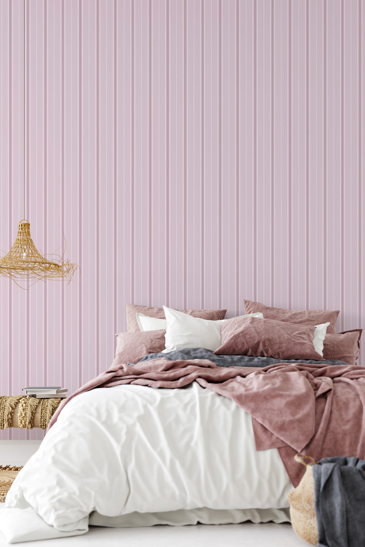 Delicate Scalloped Stripes peel and stick wallpaper in bedroom featuring pink vertical scalloped stripes.
