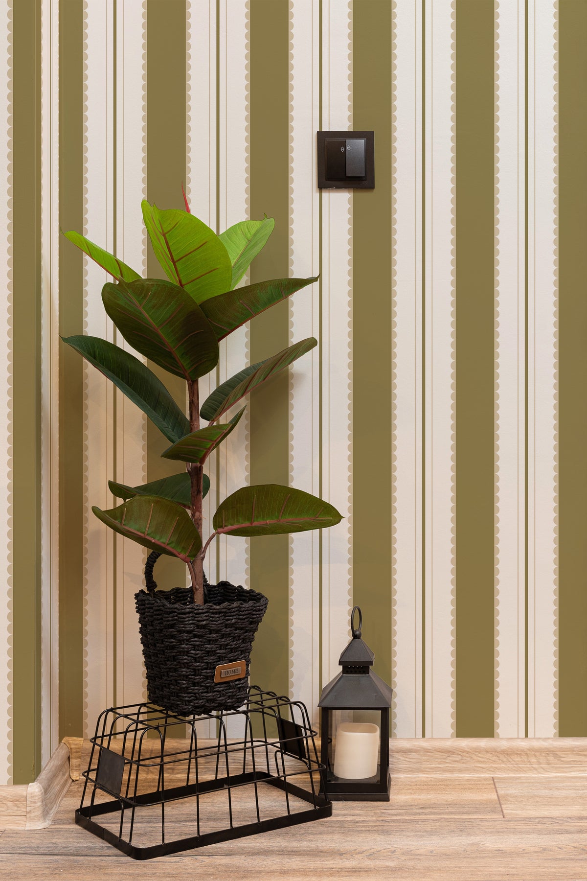 Scalloped Stripe Columns self-adhesive wallpaper on an interior wall with green scalloped stripes on white.