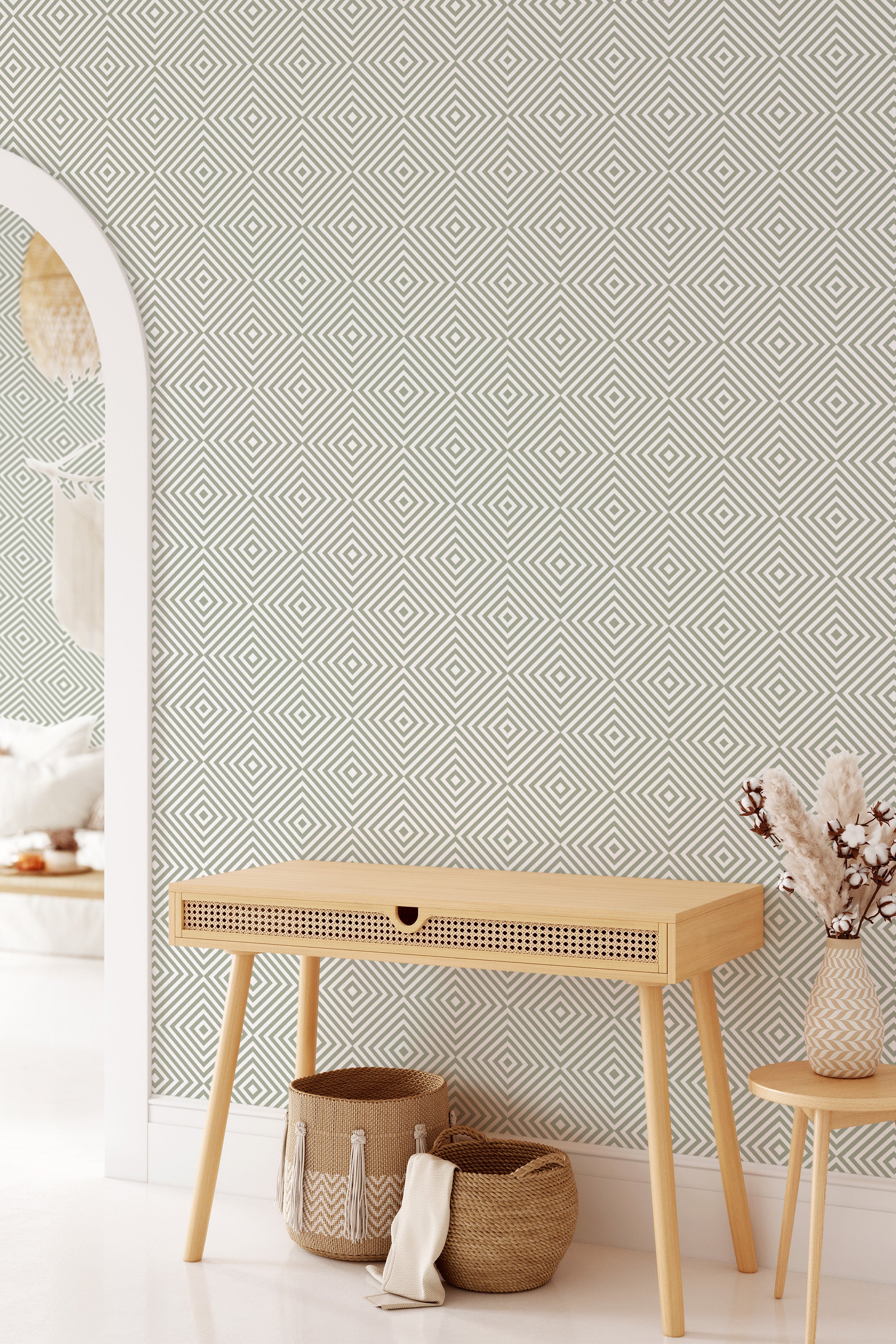 The wallpaper has an intricate geometric pattern of concentric diamonds in neutral tones, creating a visually striking and mesmerizing effect. The design follows a repetitive and symmetrical pattern that adds depth and texture to the room���s decor, embodying the essence of traditional wallpaper.