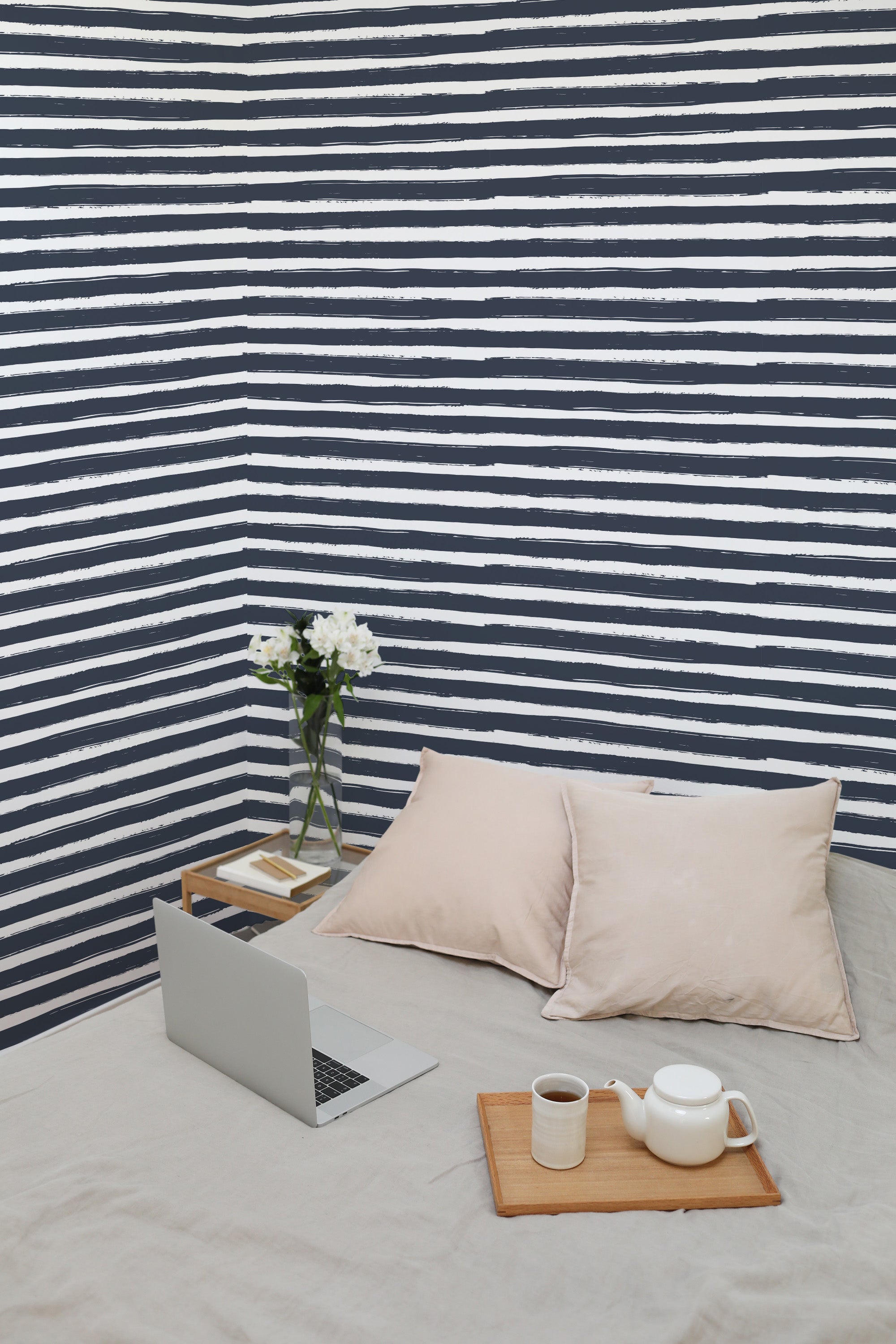 Self-adhesive wallpaper with a painted brush lines design featuring navy blue and white horizontal stripes.