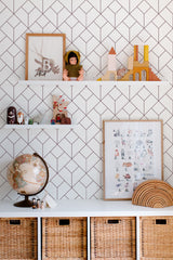 Self-adhesive Art Deco seamless pattern wallpaper with a geometric design in dark lines forming a sophisticated diamond and square repeat across the wall in a modern, stylish room.