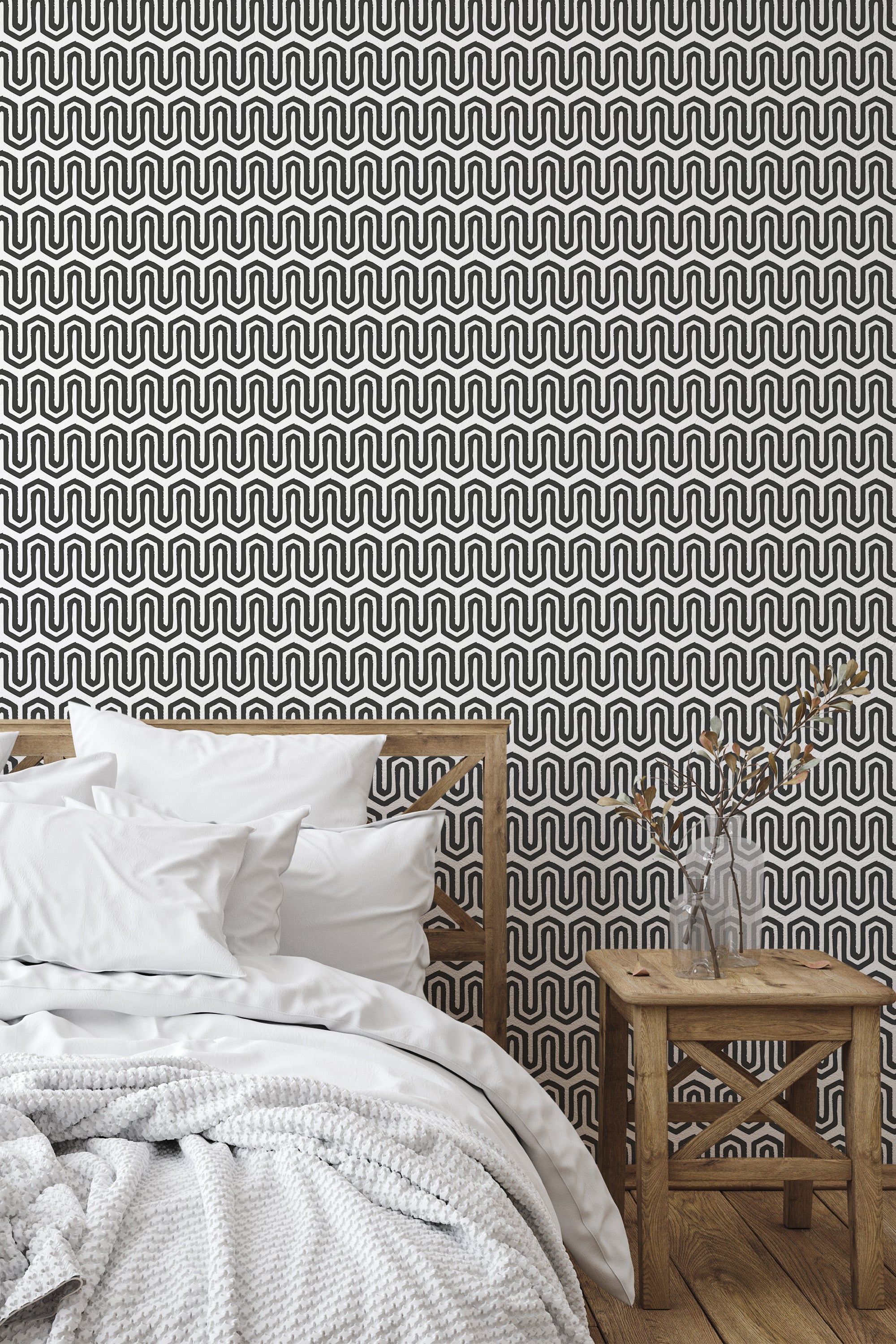 Self-adhesive wallpaper with a geometric line pattern of black and white interlocking curves creating a modern, continuous wave design on the wall.