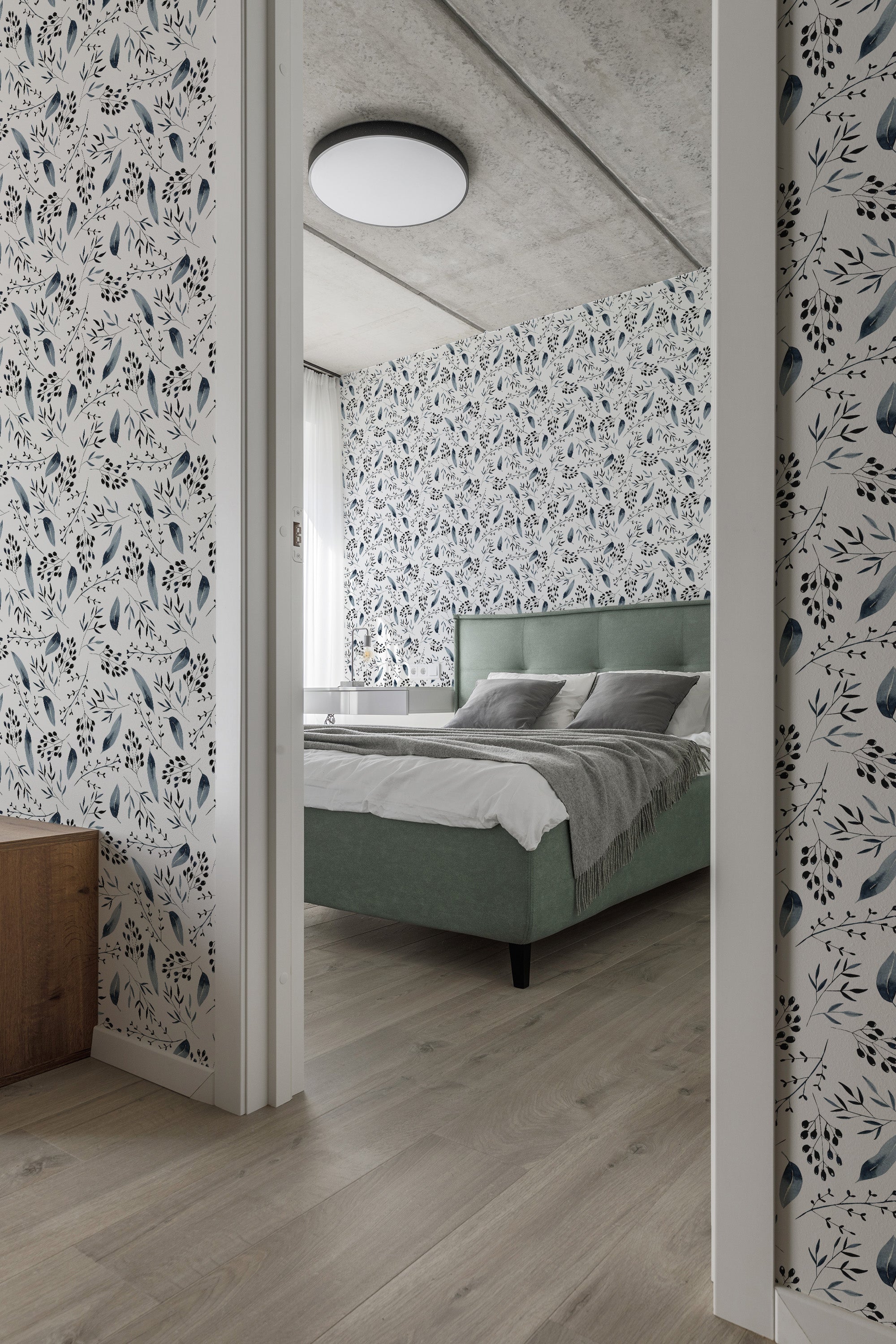 A room with floral and leaf wallpaper in soft, muted tones of blue and white, providing a cozy and vintage atmosphere. Traditional wallpaper.