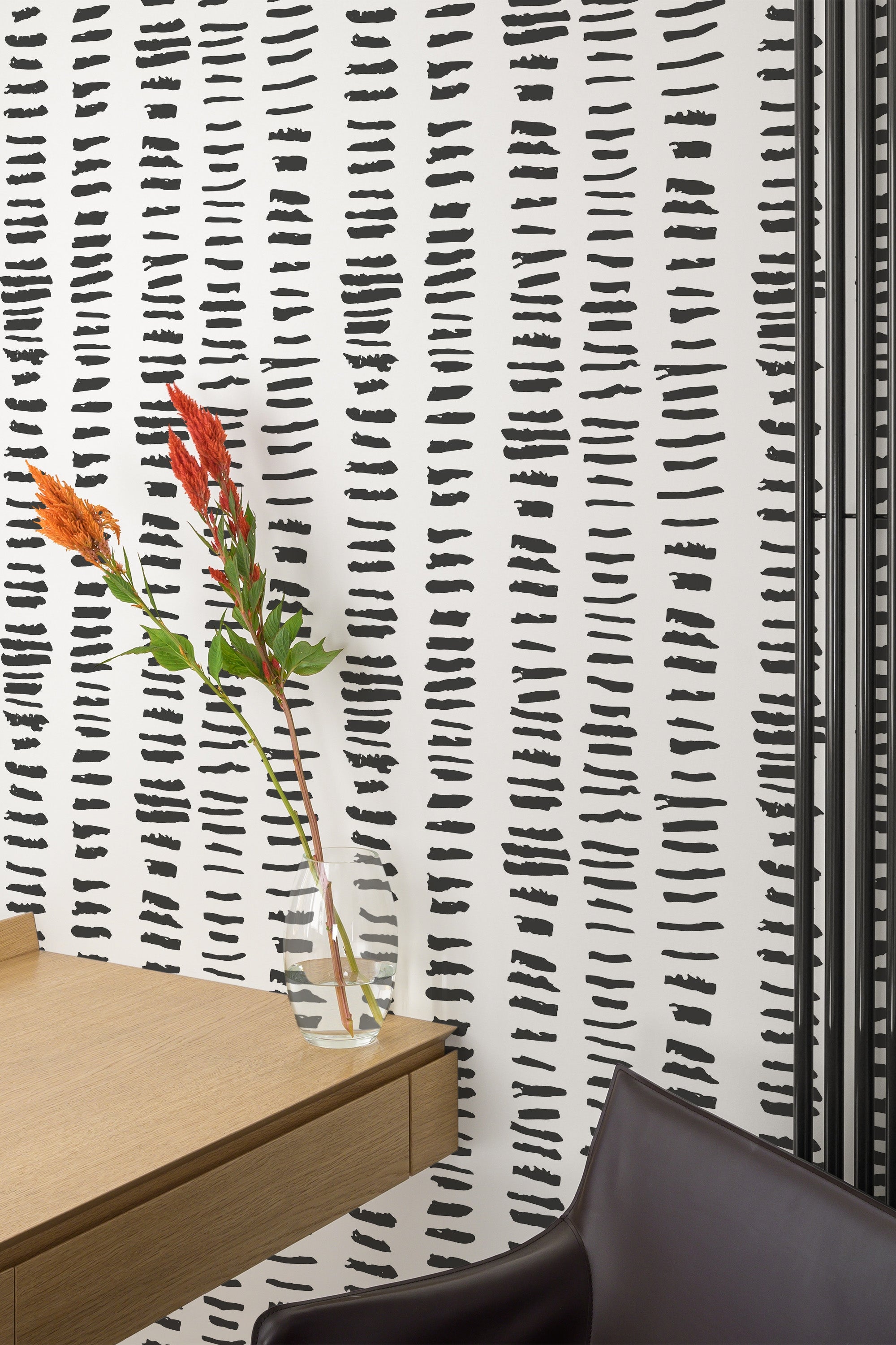 Self-adhesive wallpaper with irregular black short lines pattern on a white background, adding a modern, textured look to the room.