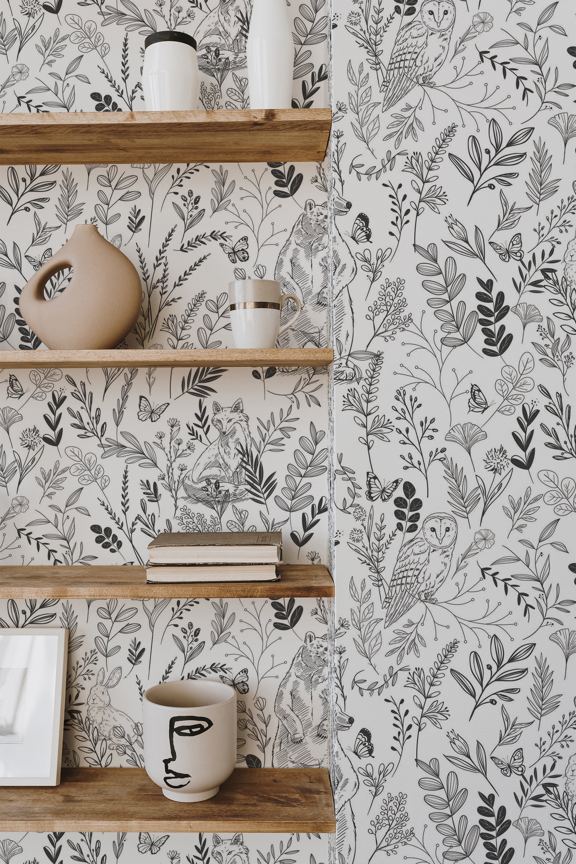 Self-adhesive wallpaper with a Forest line art design, featuring intricate black and white illustrations of owls, leaves, and branches, adding a touch of nature to the room.