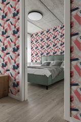 A room with walls adorned in a traditional wallpaper with an abstract brush stroke color design in shades of pink, gray, and navy blue.