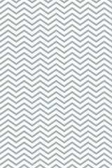 A repeating geometric pattern with zigzagging lines creates a chevron design in a soft gray color on a white background. Peel and stick removable wallpaper.