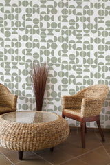 Self-adhesive wallpaper with a Mid-century modern design featuring geometric shapes in muted green against a cream background, creating a retro yet sophisticated look.