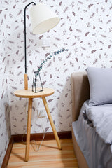 Self-adhesive floral print wallpaper with a white background adorned with delicate brown leaves and branches in an irregular pattern.