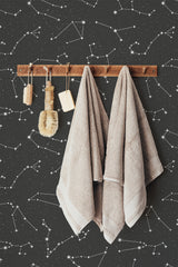 Self-adhesive wallpaper with a constellation design, showing white star patterns connected by dotted lines on a dark background.