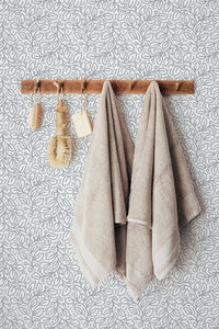 Self-adhesive Seamless Leaf wallpaper with a gray leaf pattern on a white background, adding a natural and elegant touch to the room.