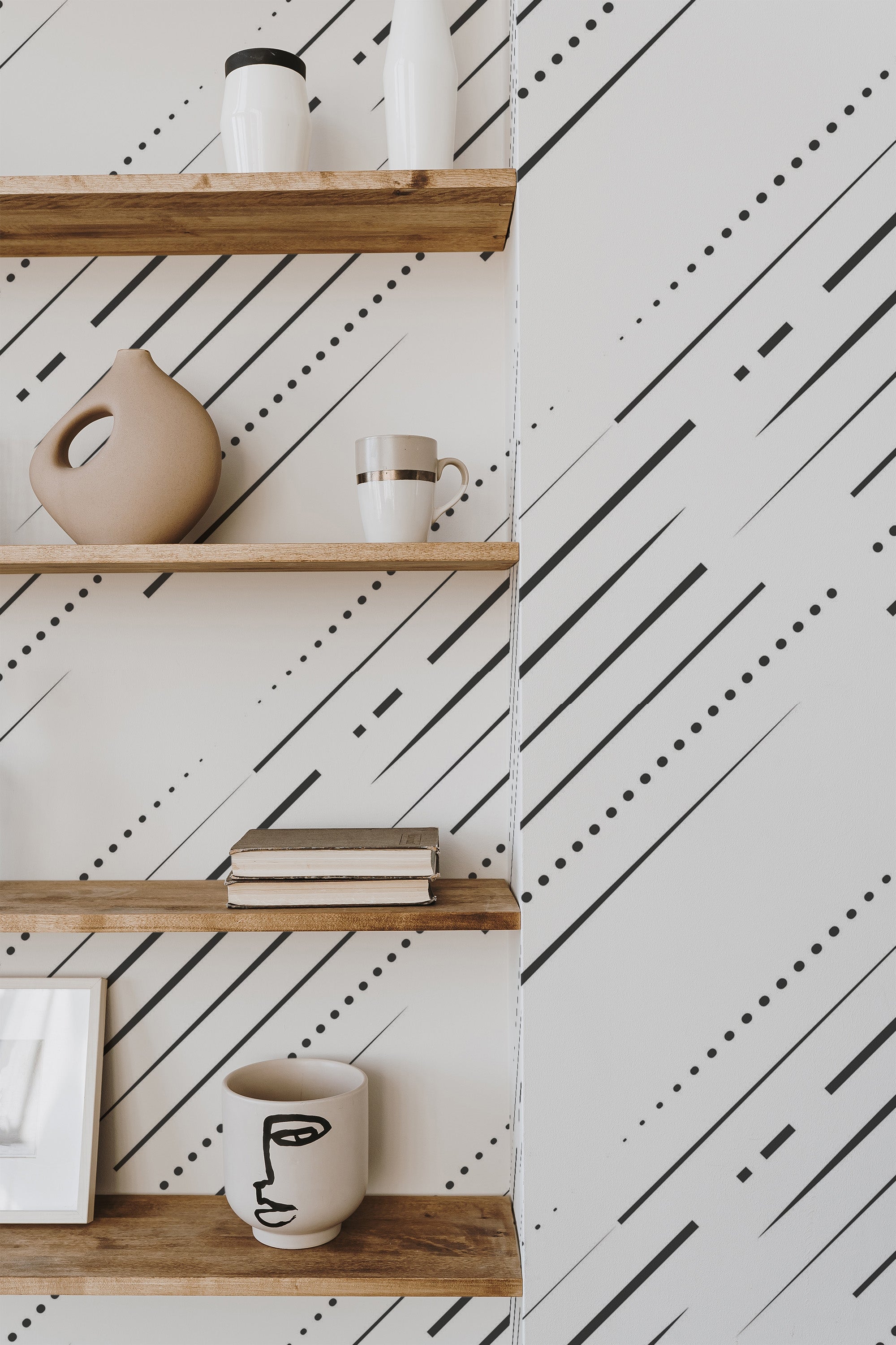Self-adhesive abstract line wallpaper with black diagonal lines, dots, and dashes on a light white background, adding a modern, minimalist aesthetic to the room.