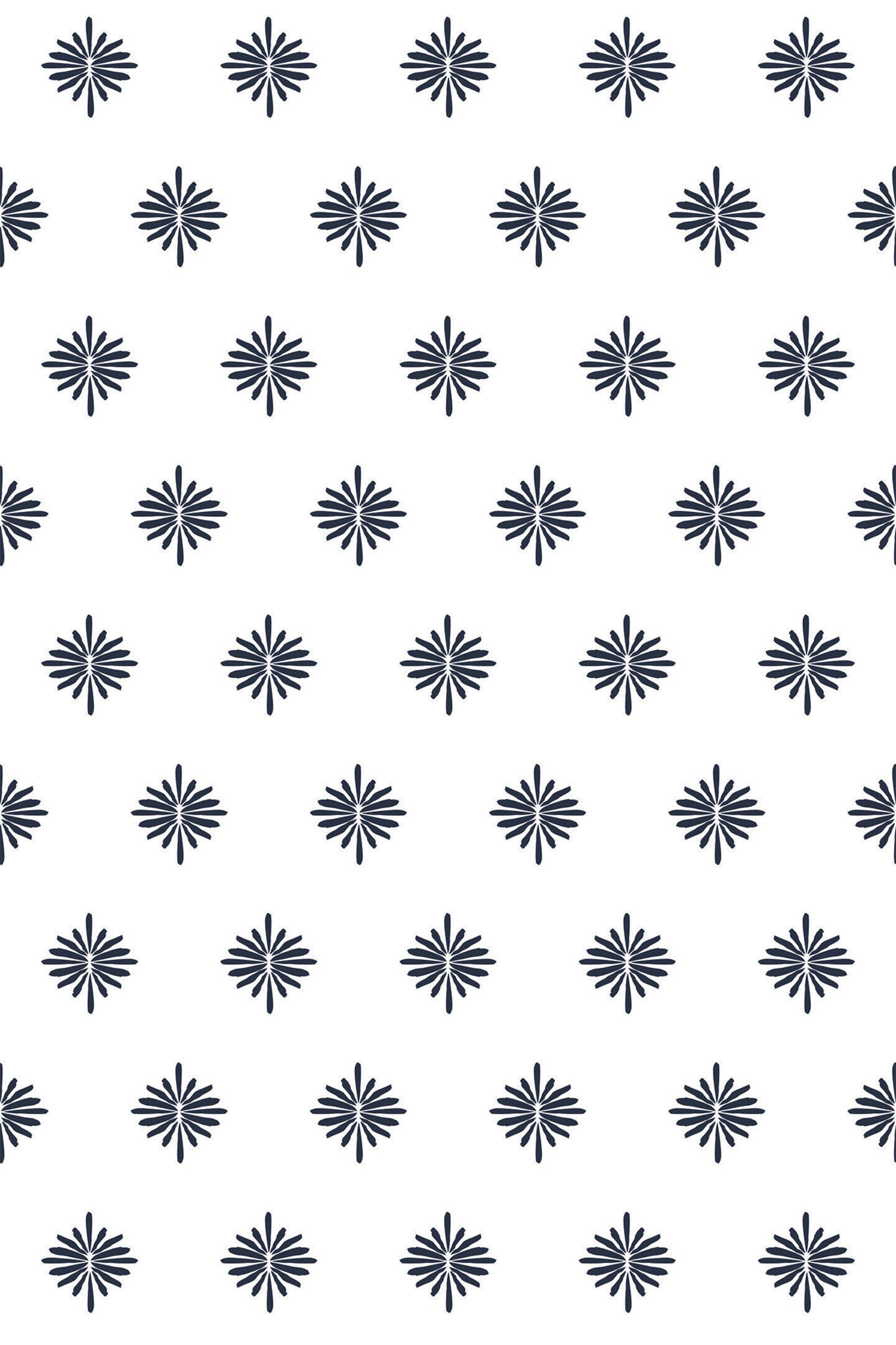 A repeating pattern of navy blue floral starbursts on a white background, arranged in evenly spaced diagonal rows. Peel and stick removable wallpaper.