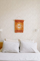 Self-adhesive modern geometric wallpaper with clean, intersecting lines forming a subtle and minimalist pattern on a light beige background. The design adds a contemporary touch to the room, creating a calming yet stylish atmosphere.