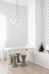 A room with a modern checkered wallpaper pattern in shades of gray, black, and white, arranged in a grid style with small tiles resembling a minimalist mosaic, traditional wallpaper.