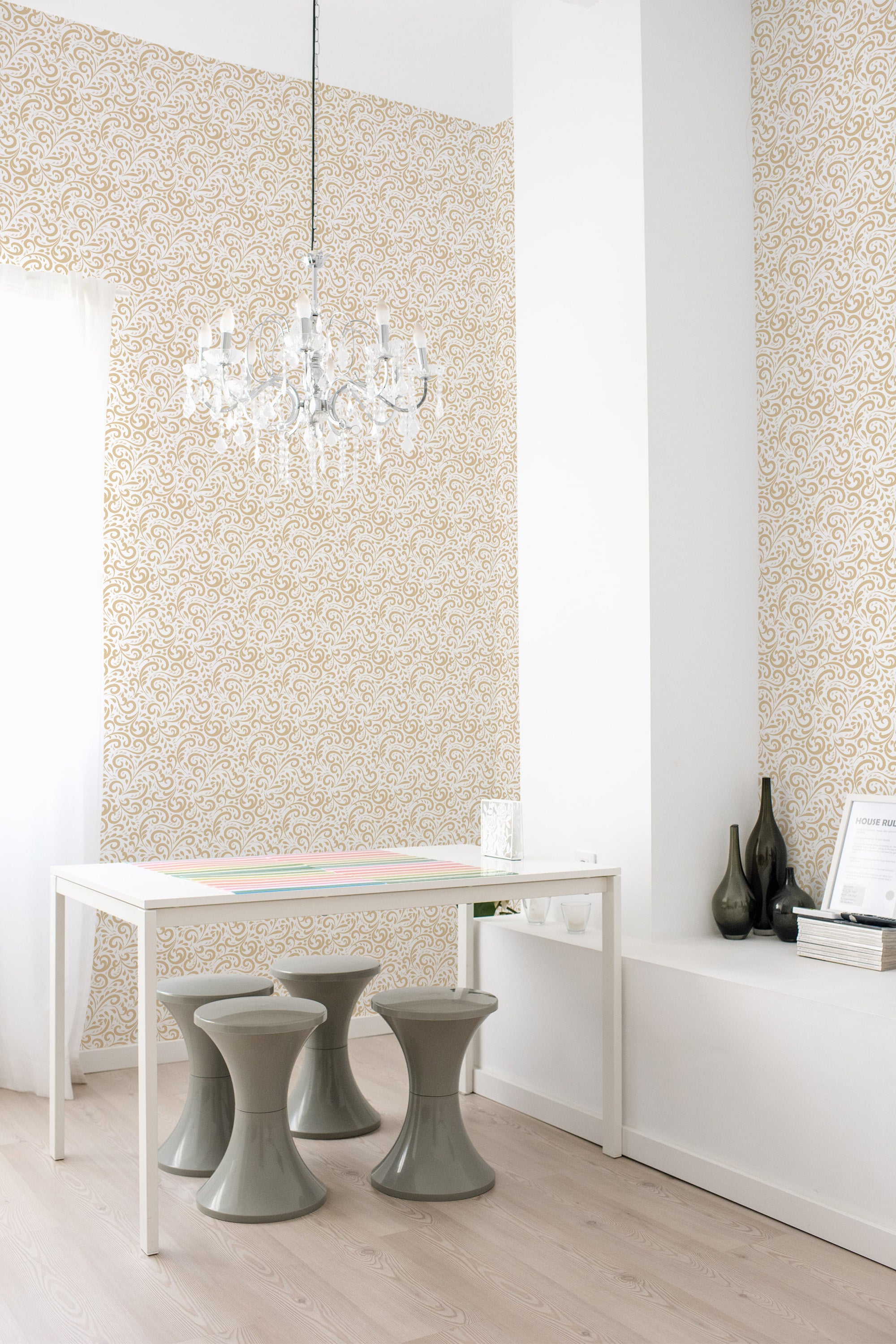 A room with walls covered in a Vintage ornament wallpaper design with intricate golden patterns and swirls set against a beige background, creating a warm and classic ambiance. Traditional wallpaper.