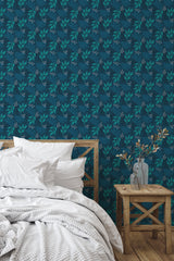Self-adhesive wallpaper with a dark blue background and intricate leaf patterns in shades of blue and green, creating a calming, nature-inspired ambiance in the room.