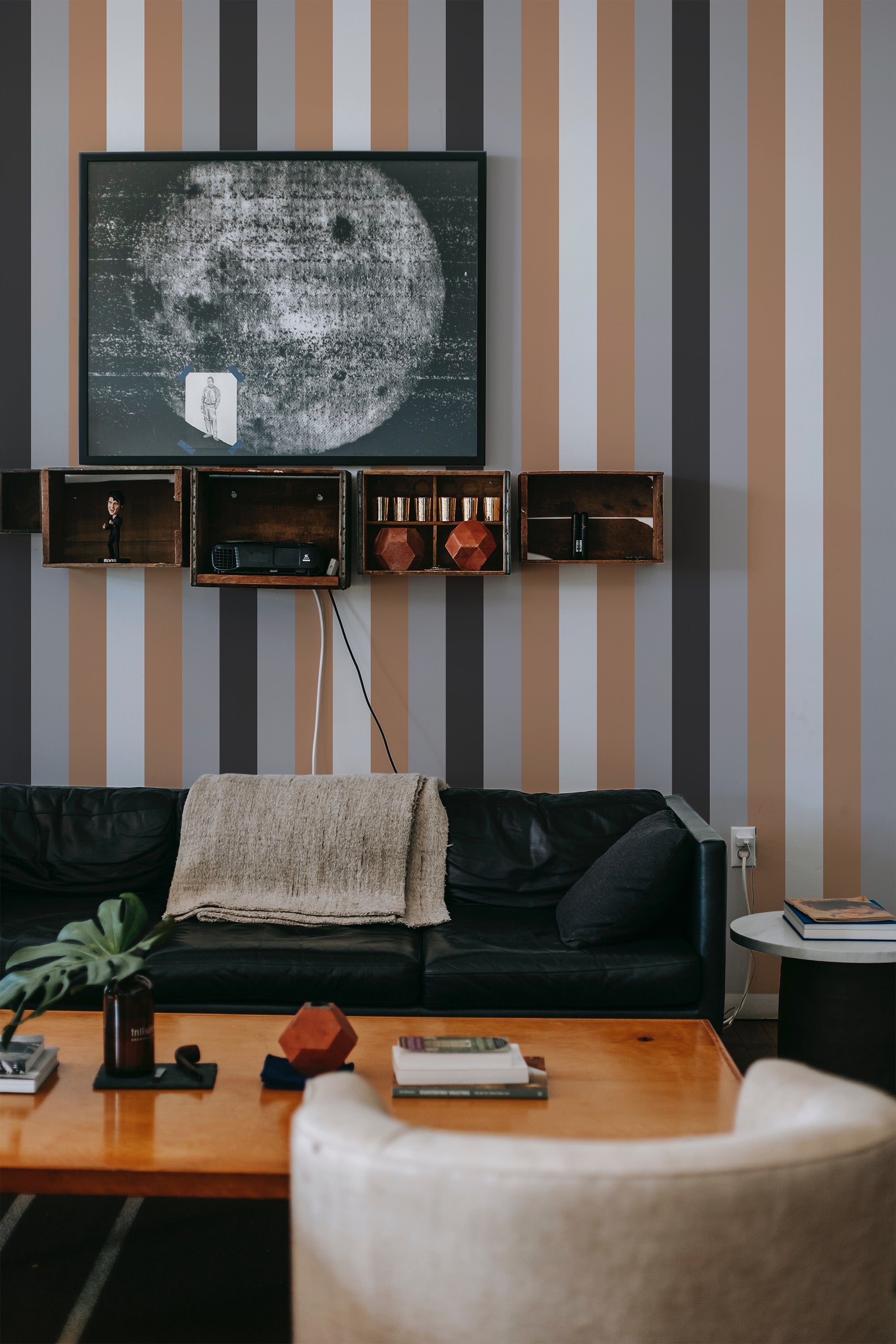 Vertical brown, tan, gray, and off-white stripes alternating evenly across the wall, creating a refined and symmetrical pattern. Traditional wallpaper.
