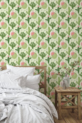 Self-adhesive cactus pattern wallpaper with vibrant green cacti accented by pink flowers and light green circular elements on a cream background.