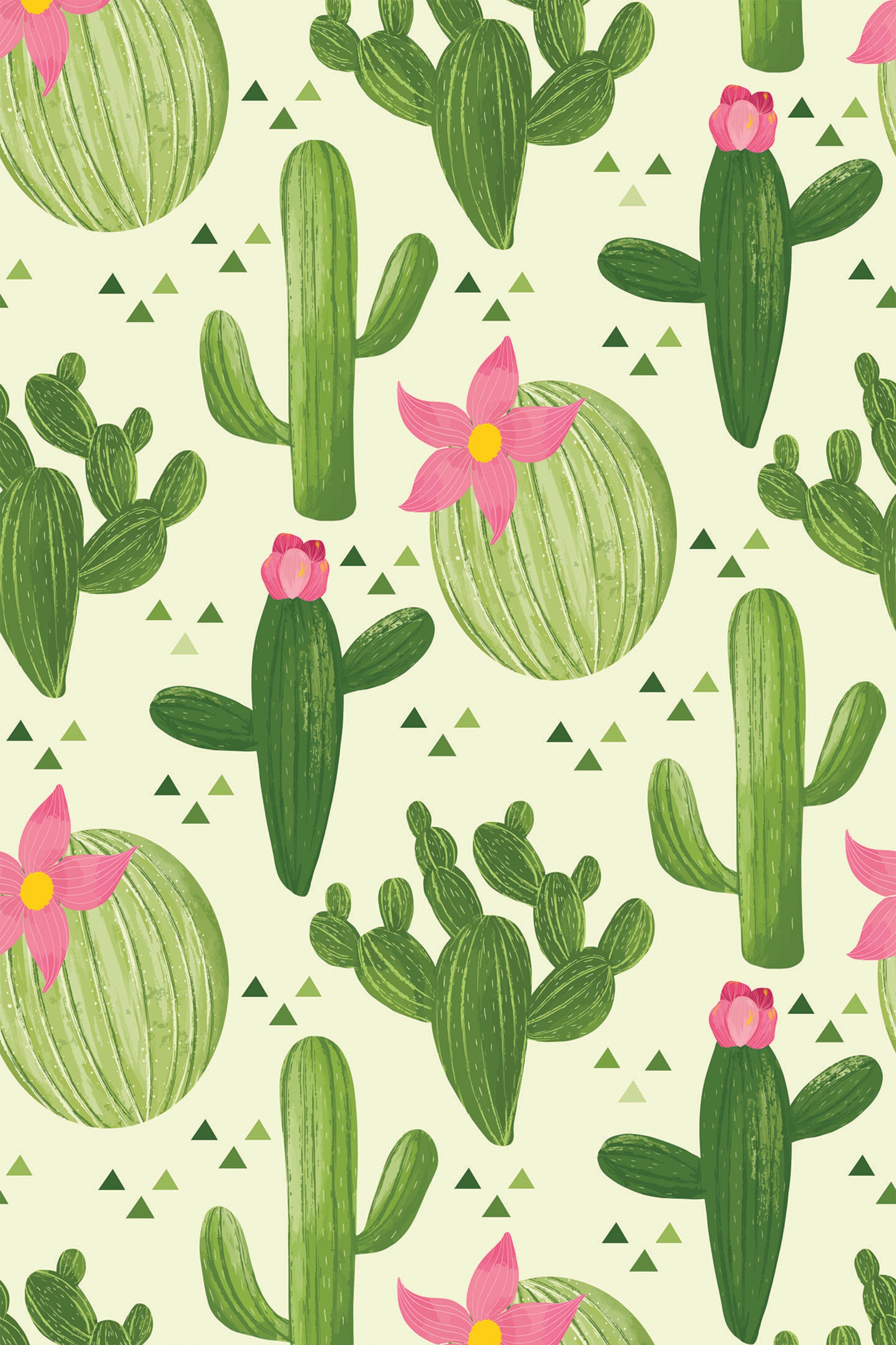 A repeating cactus pattern with various types of green cacti, including saguaro and prickly pear, scattered on a light background. Pink flowers adorn some cacti, and small green triangles accent the design. Peel and stick removable wallpaper.