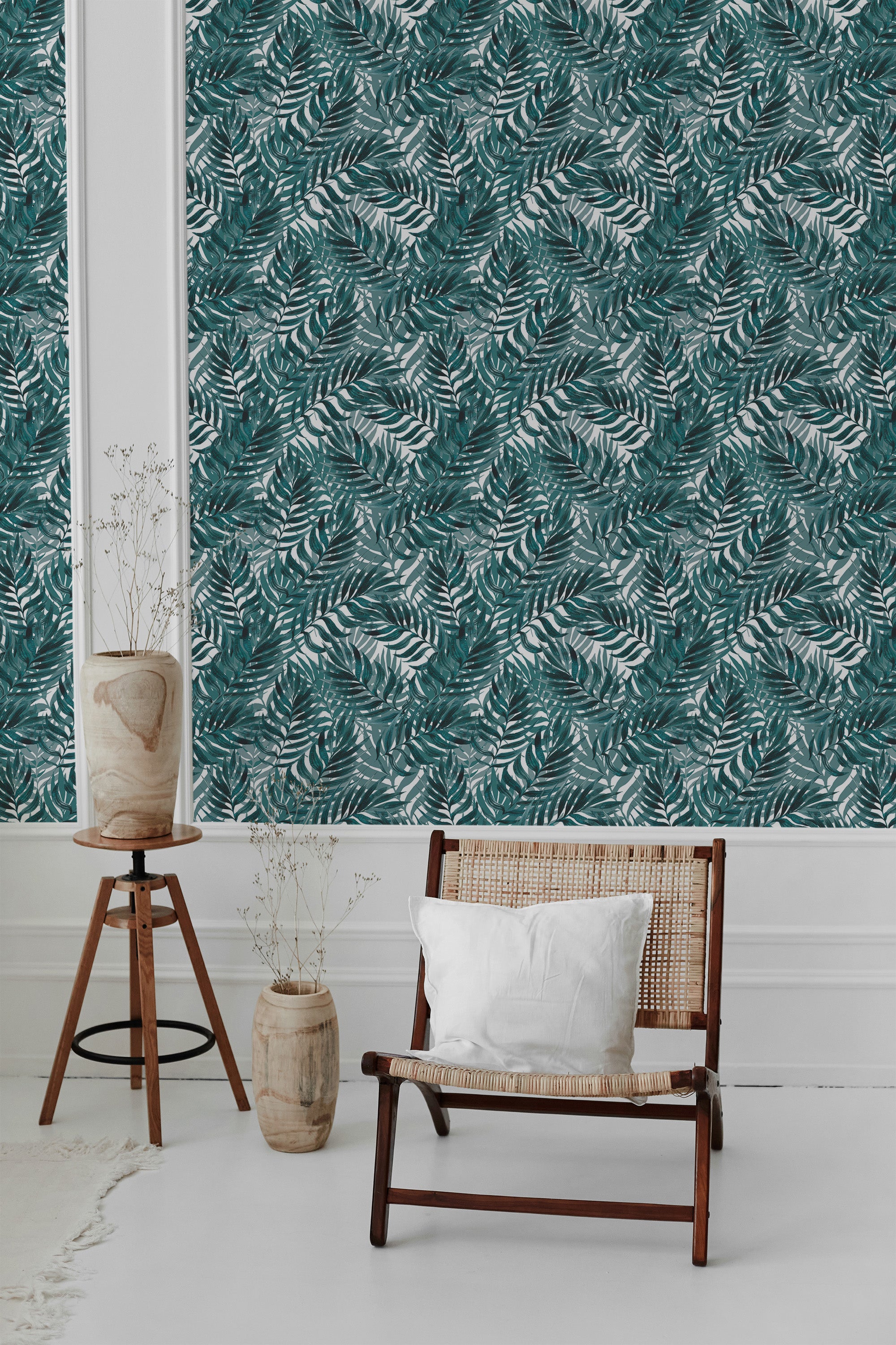 A room with blue tropical leaf wallpaper, highlighting lush green leaves against a muted background, creating a fresh and serene atmosphere. Traditional wallpaper.