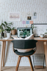 Self-adhesive wallpaper with an Art Deco fence design in soft beige and white tones, creating a stylish geometric pattern of arches and lines that adds a touch of elegance to the room.