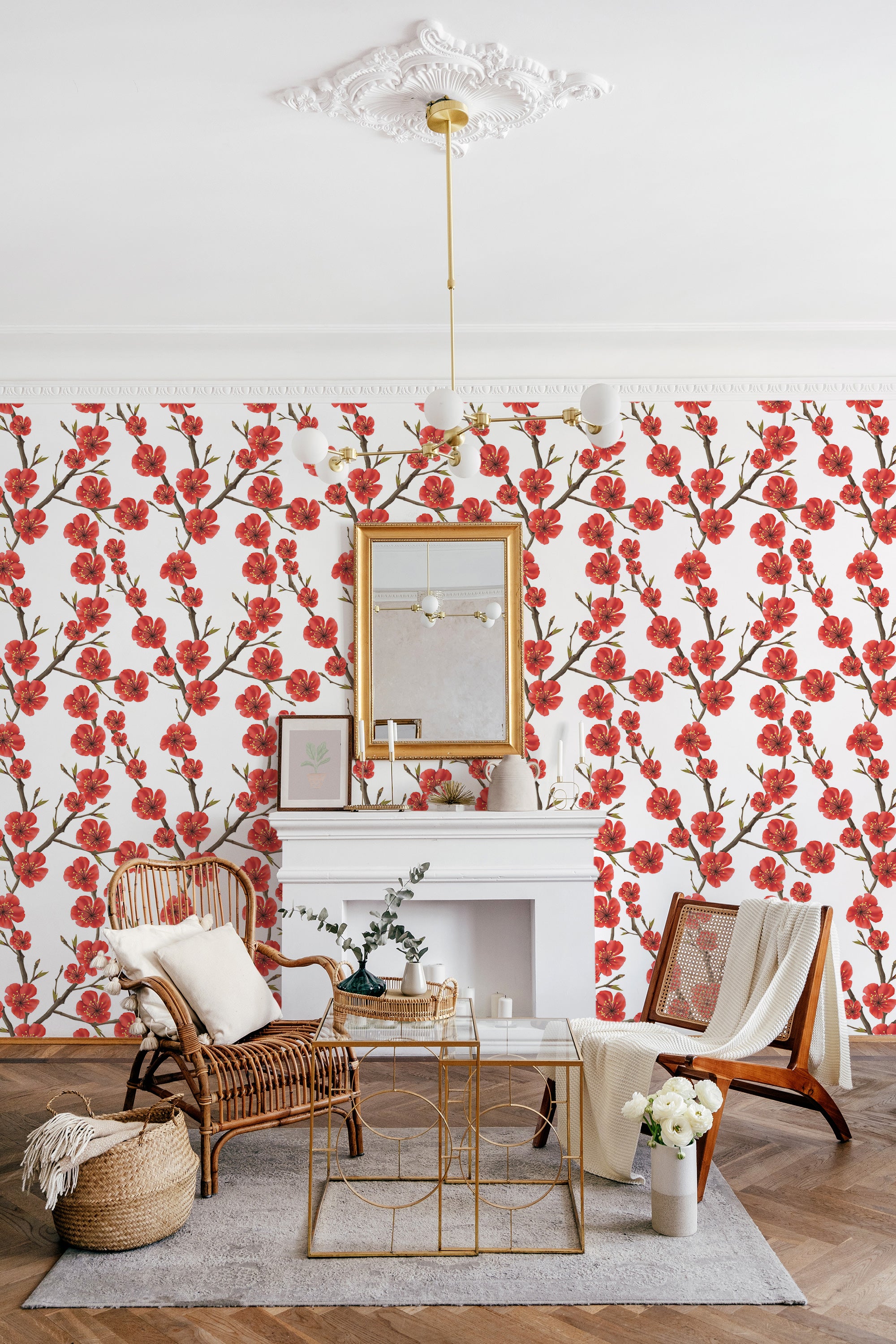 Red and pink spring flowers with green leaves spread across a white background in a repeating pattern, creating an elegant and lively ambiance. Traditional wallpaper.