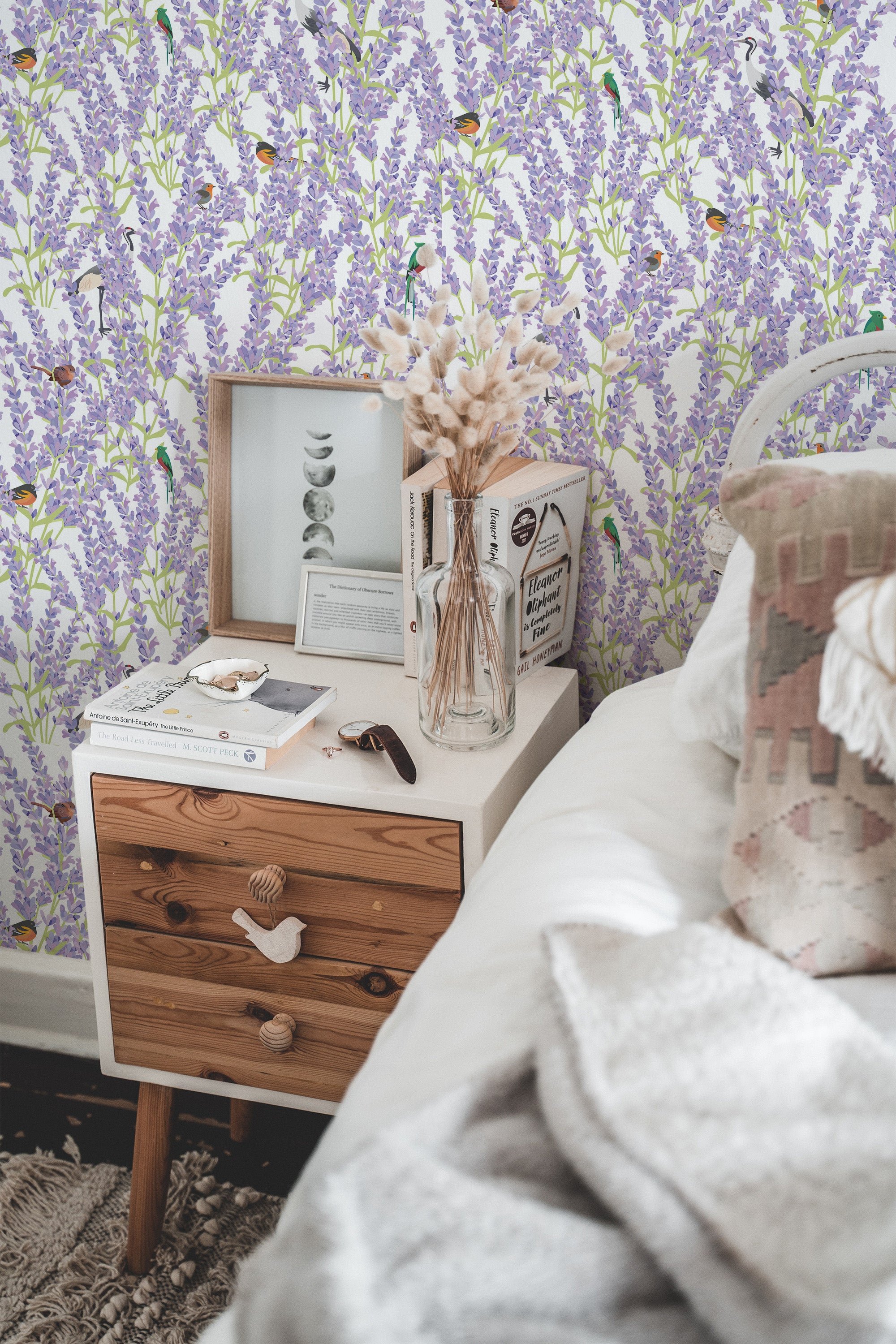 Self-adhesive wallpaper with delicate lavender flowers and whimsical birds in soft, muted tones, creating a serene and natural atmosphere in the room.