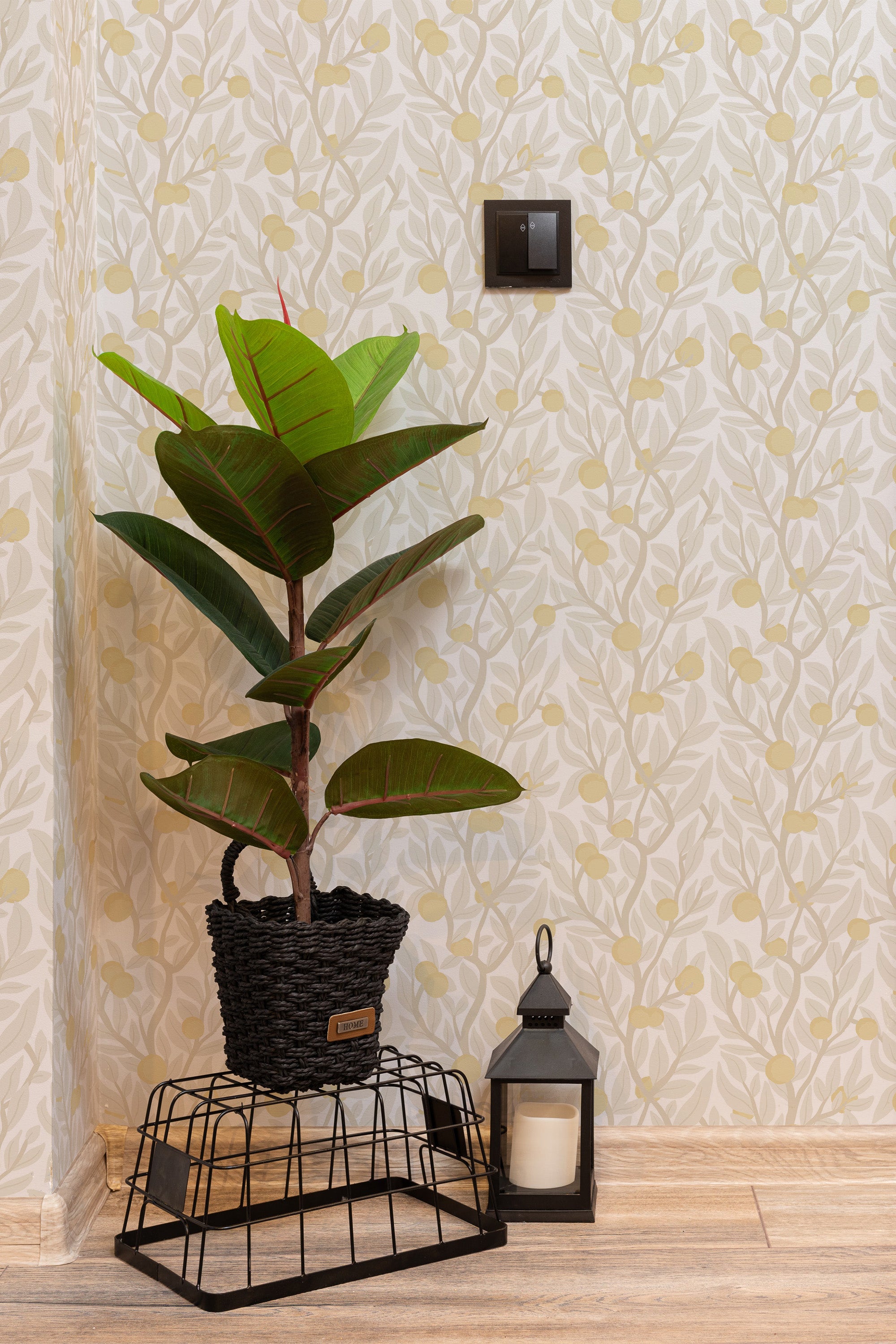 Self-adhesive wallpaper with a Citrus tree design, consisting of subtle green leaves and yellow fruit patterns on a light beige background.