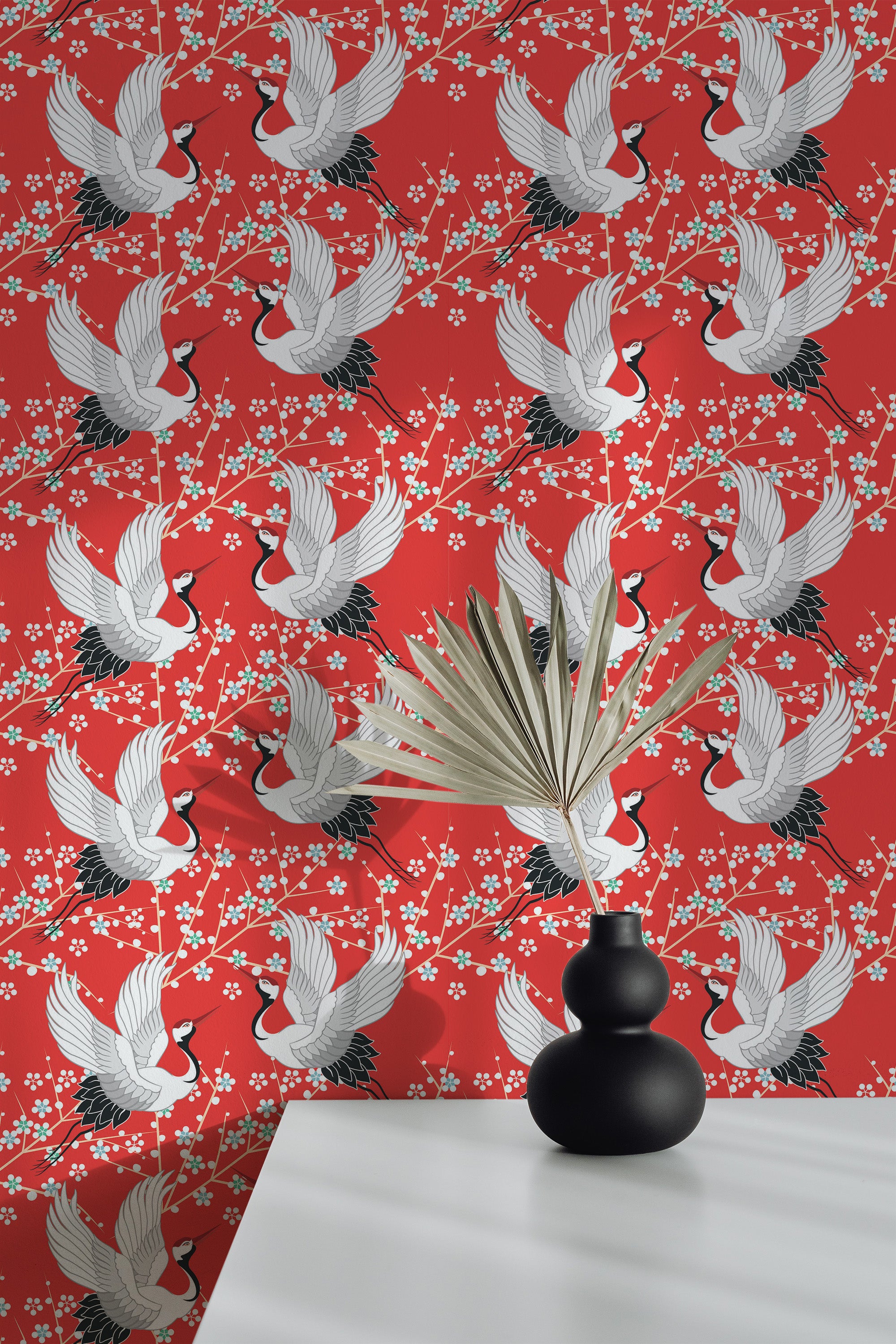 Self-adhesive wallpaper with an Oriental motif of white cranes in mid-flight, set against a vibrant red background with delicate white cherry blossoms.