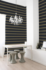 Room with elegant wallpaper in a dark hue adorned with horizontal golden dotted lines creating a sophisticated pattern, traditional wallpaper.