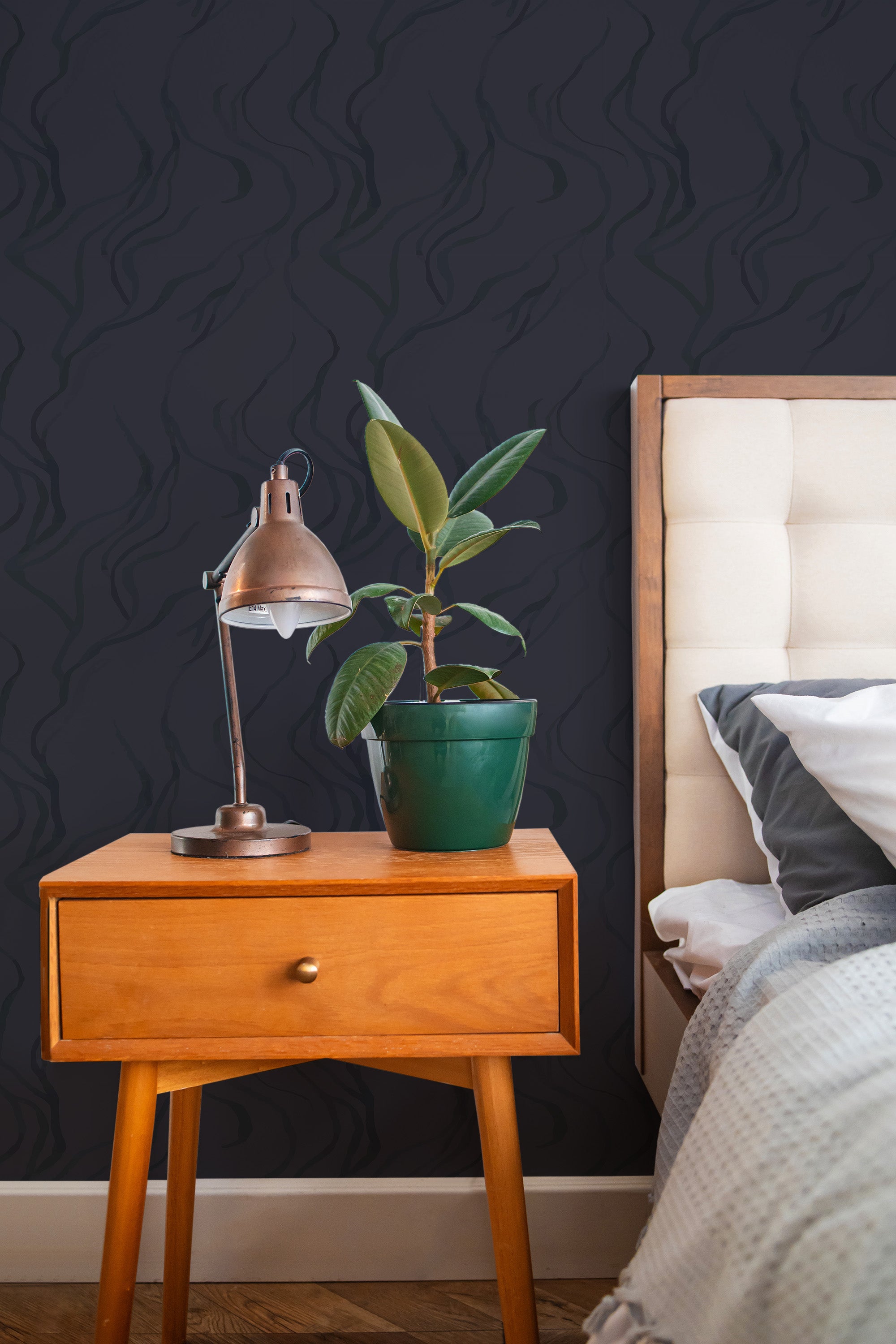 Self-adhesive wallpaper with a sleek black design featuring thin, wavy lines.