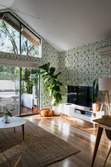 Wallpaper with a pattern of green bamboo trees delicately arranged on a light-colored background, creating a serene and nature-inspired atmosphere. Traditional wallpaper.