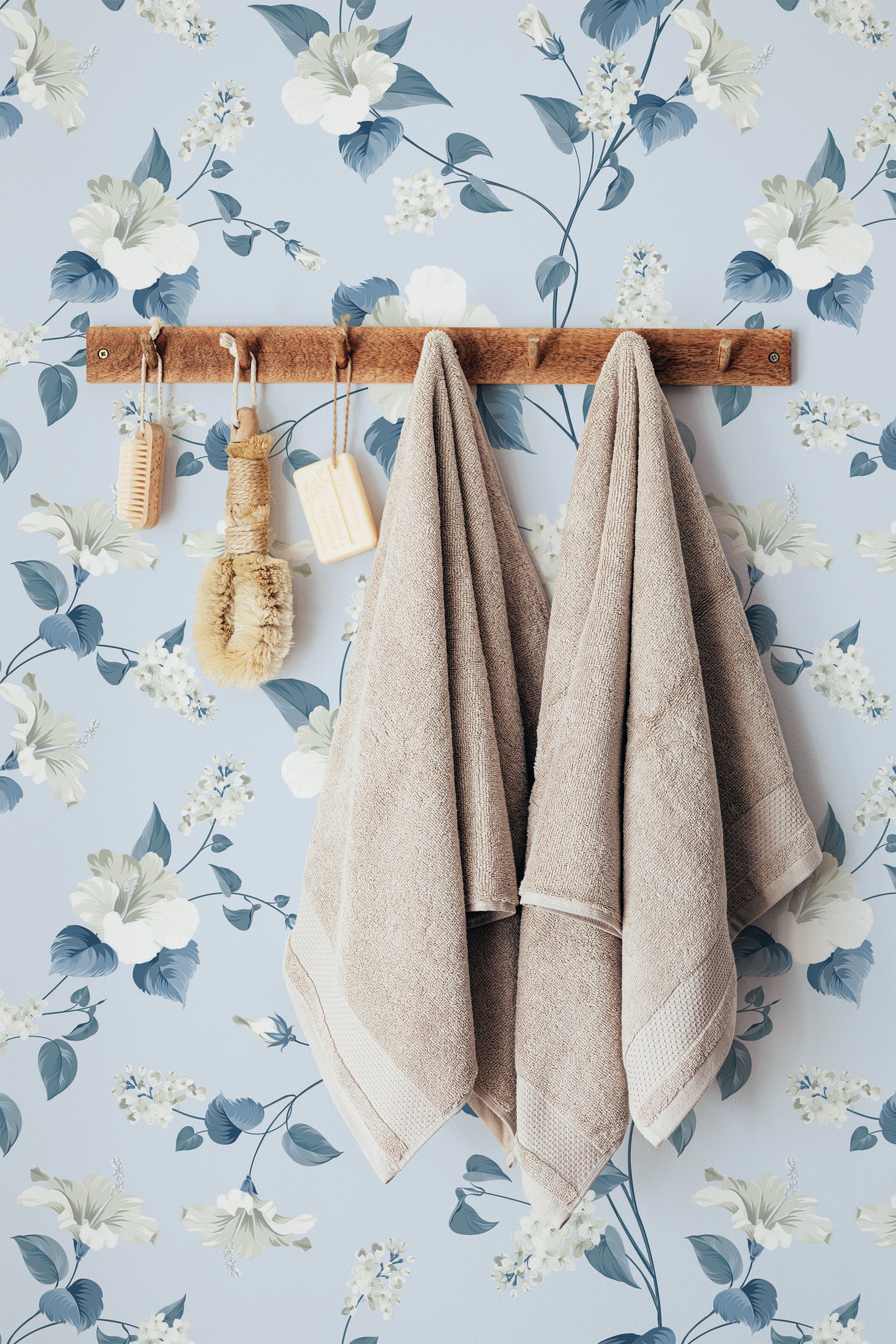 Self-adhesive Blue floral wallpaper with large white flowers and green leaves on a light blue background, creating a serene and calming atmosphere in the room.