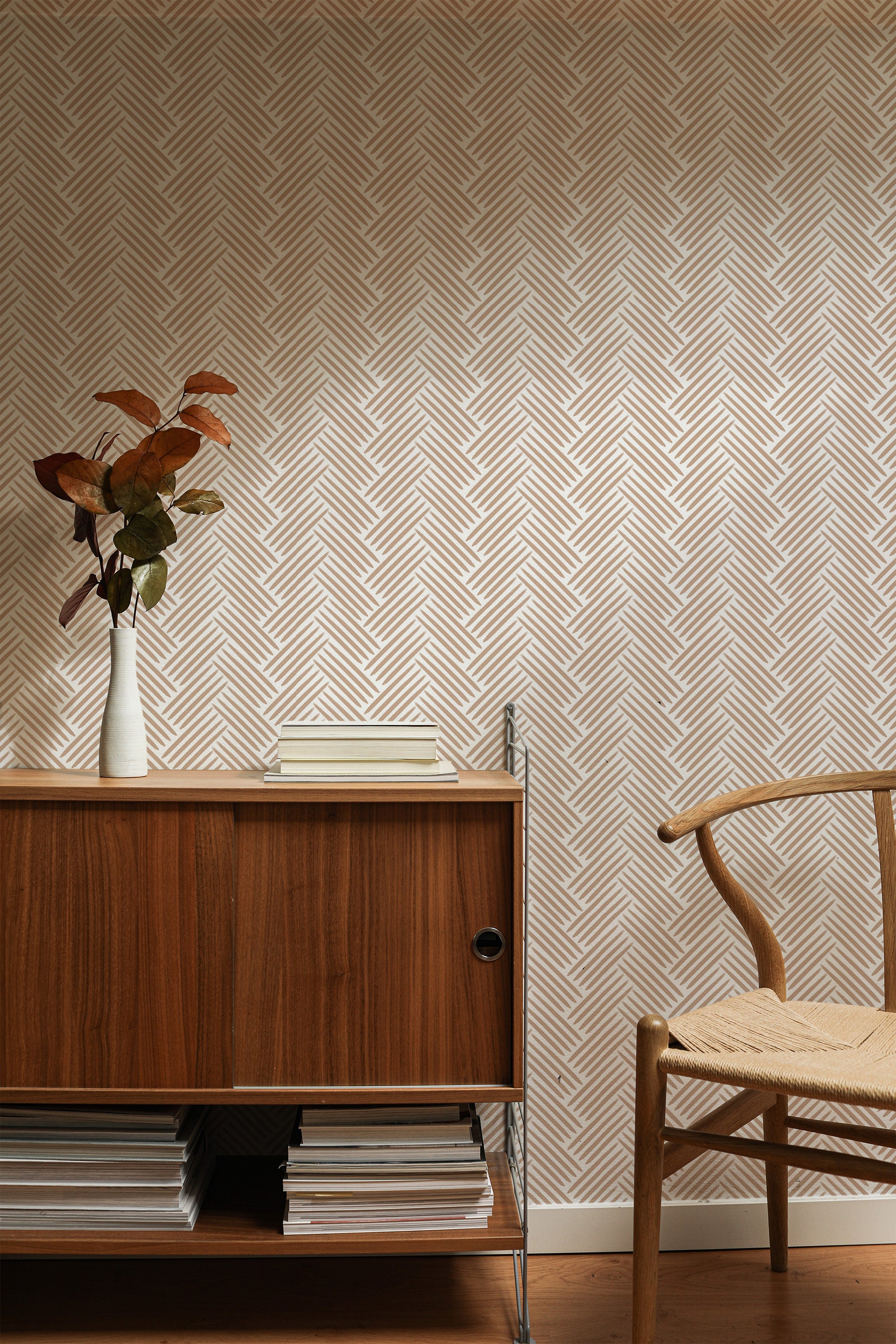 Self-adhesive wallpaper with a brush herringbone pattern in soft, neutral tones. The design creates a textured look with a chevron-like appearance.