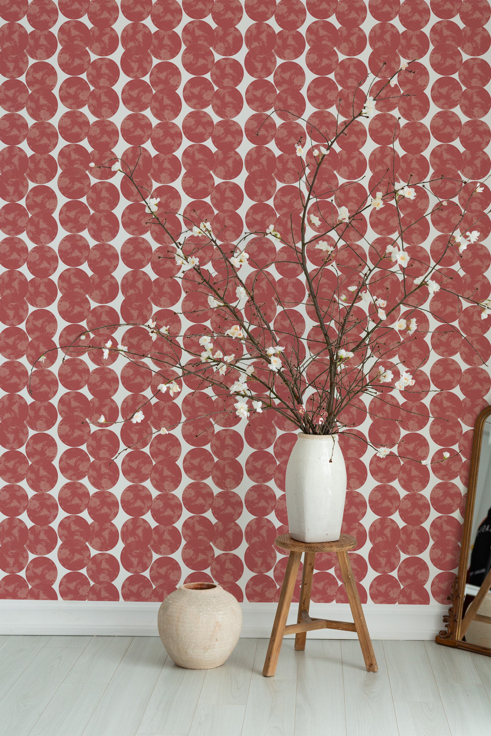 Self-adhesive wallpaper with a playful pattern of overlapping red circles, resembling abstract dumbo shapes. The design creates a lively and modern atmosphere, perfect for adding a pop of color and visual interest to any space.
