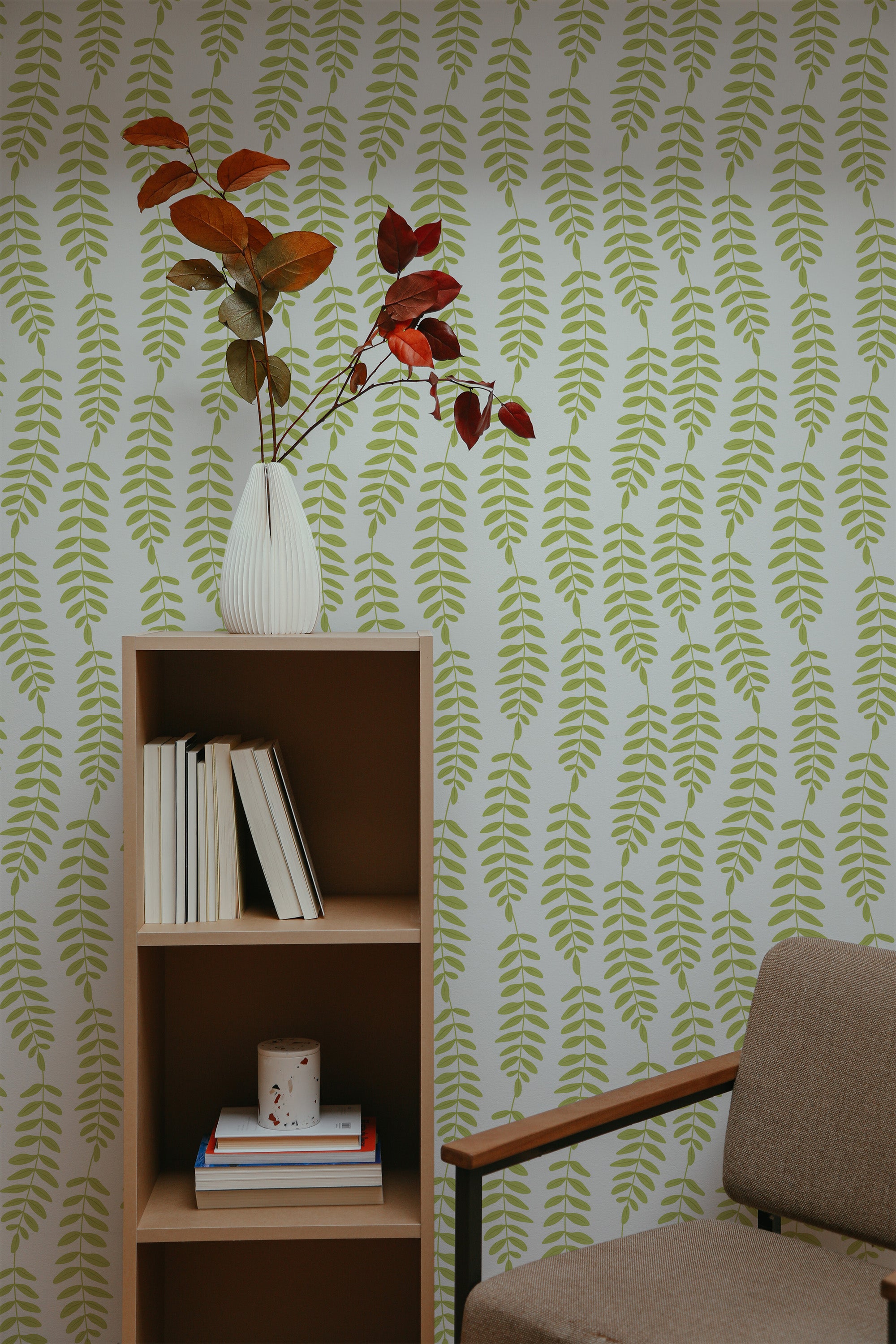 Self-adhesive wallpaper with a green leaf line design, creating a pattern of vertically oriented leaf textures.