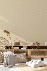 Beige wallpaper with a minimalist geometric pattern formed by intersecting lines creating diamond shapes, complementing a cozy, traditional room decor. Traditional wallpaper.
