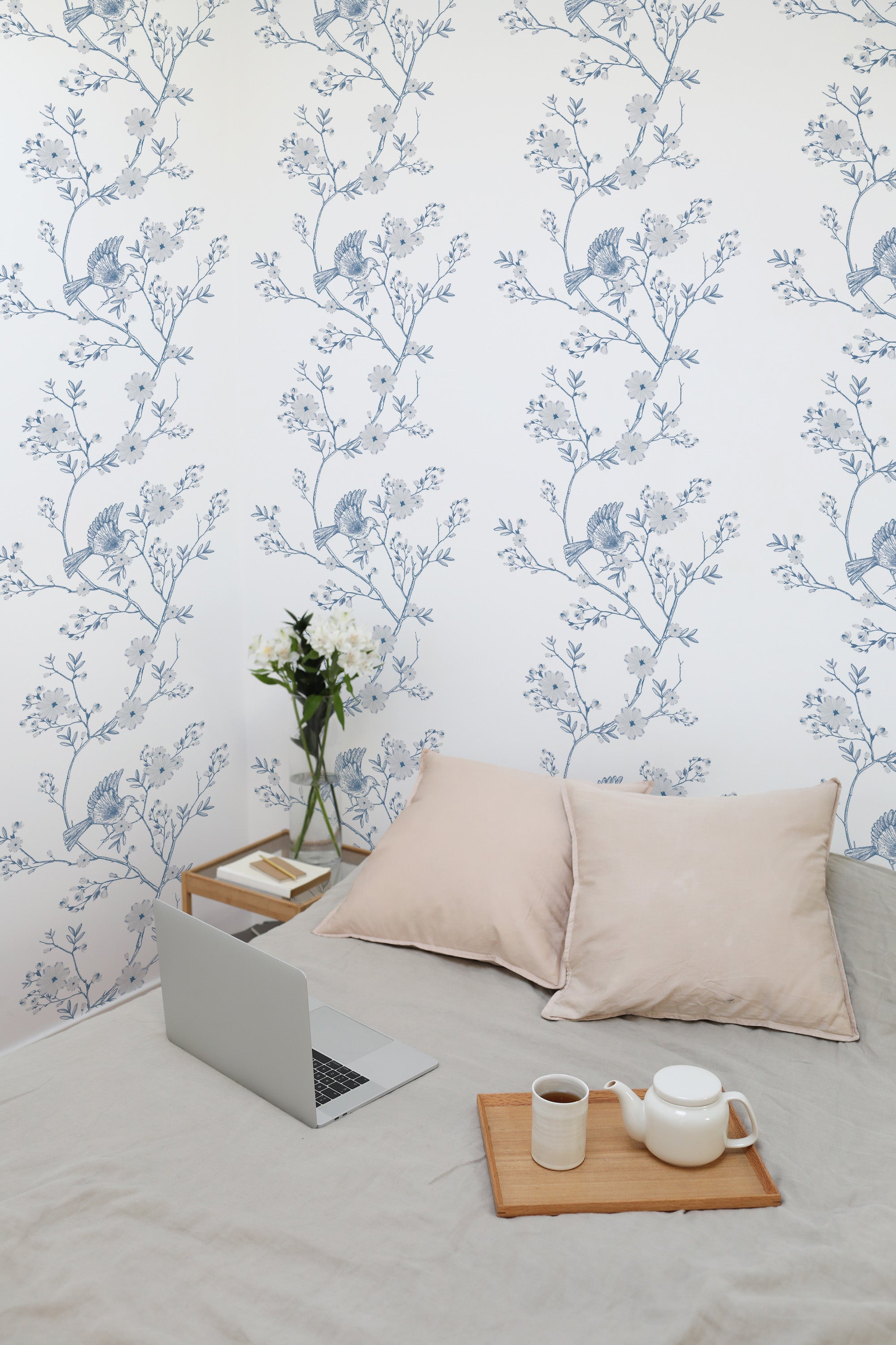 Self-adhesive wallpaper with a Blue Farmhouse Bird design, featuring delicate blue birds perched on branches with small blossoms against a white background, creating a peaceful nature-inspired ambiance in the room.
