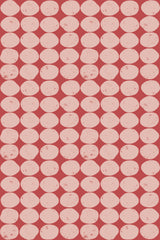 Vintage-inspired design with a repeating pattern of distressed pink circles arranged in a staggered grid on a red background. Peel and stick removable wallpaper.