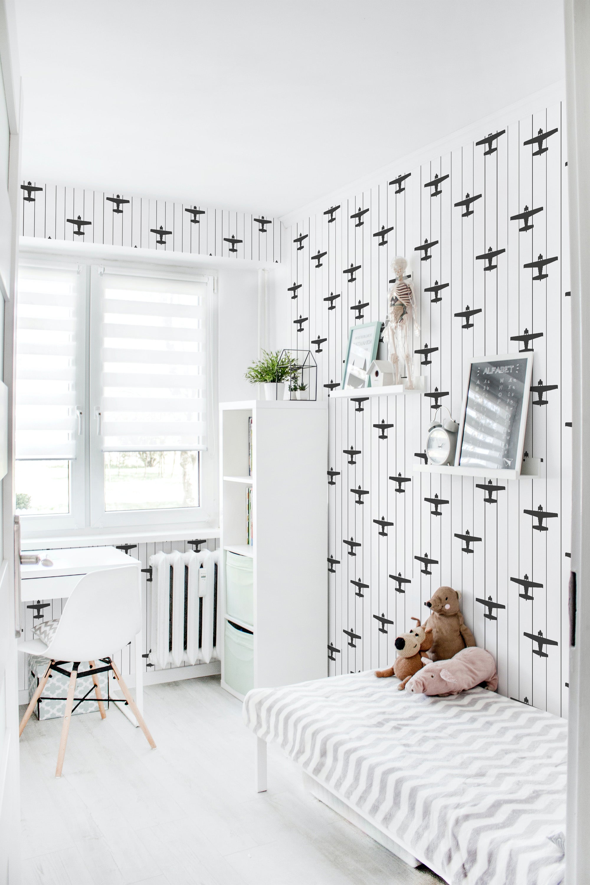 Wallpaper with a pattern of vintage airplanes in a repeating design, set against a white background with thin vertical black stripes. Traditional wallpaper.