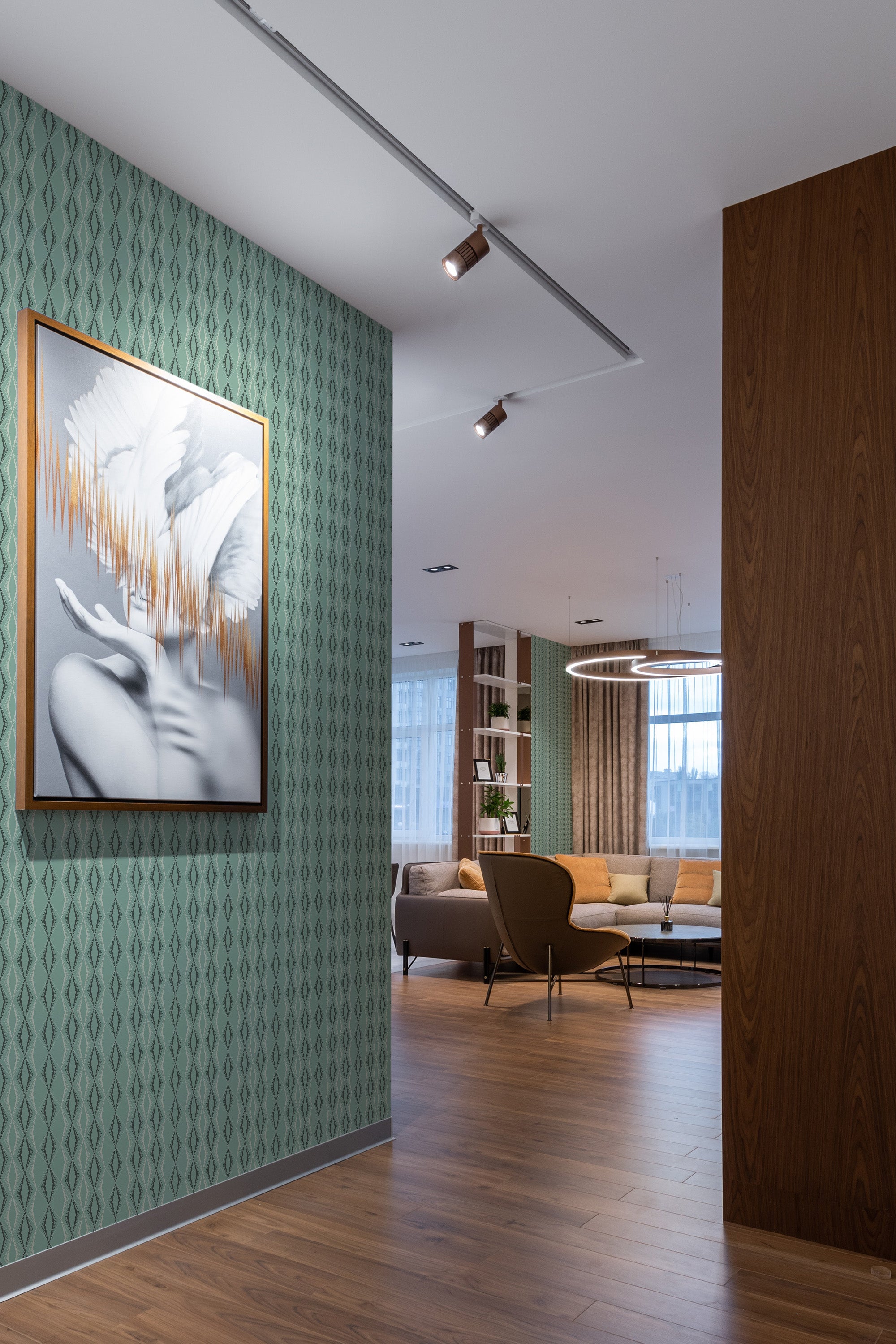 Retro green wallpaper with a geometric pattern of repeating narrow diamond shapes in a subtle, muted green tone, creating a vintage-inspired look. Traditional wallpaper.